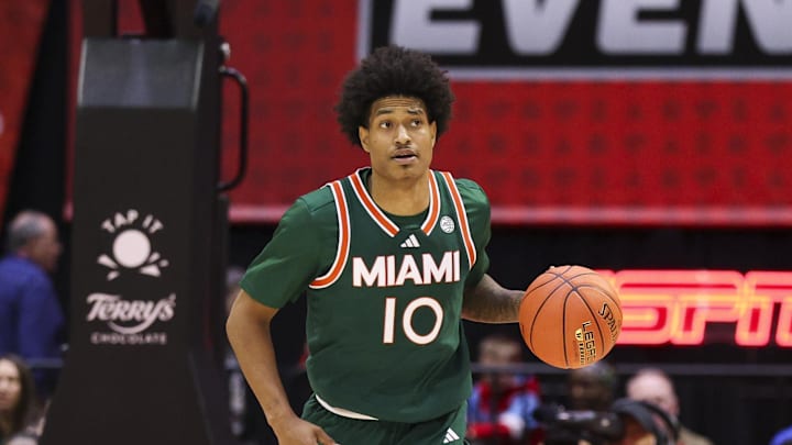 Nov 28, 2025; Kissimmee, FL, USA; Miami (FL) Hurricanes guard Tru Washington (10) controls the ball against the Georgetown Hoyas in the second half during the ESPN Events Invitational at State Farm Field House. Mandatory Credit: Nathan Ray Seebeck-Imagn Images