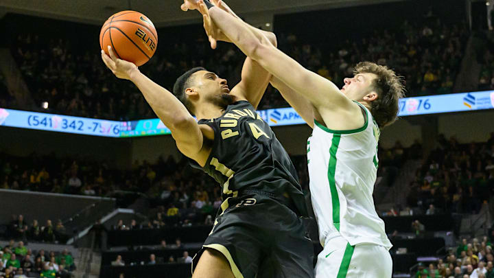 Purdue Boilermakers forward Trey Kaufman-Renn (4) shoots the ball inside against Oregon Ducks center Nate Bittle (32).