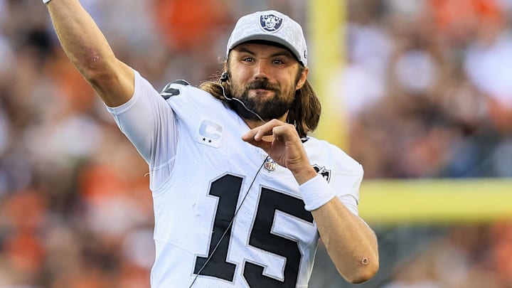 Nov 3, 2024; Cincinnati, Ohio, USA; Las Vegas Raiders quarterback Gardner Minshew (15) warms up on the sidelines during the second half against the Cincinnati Bengals at Paycor Stadium. Mandatory Credit: Katie Stratman-Imagn Images