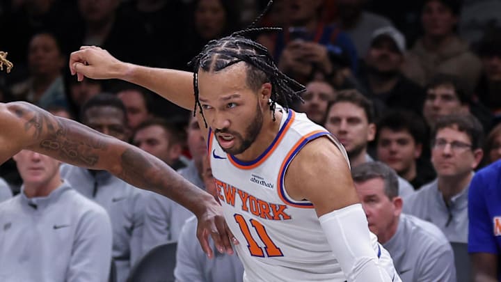 Nov 24, 2025; Brooklyn, New York, USA; New York Knicks guard Jalen Brunson (11) dribbles against Brooklyn Nets forward Noah Clowney (21) during the first quarter at Barclays Center. Mandatory Credit: Vincent Carchietta-Imagn Images