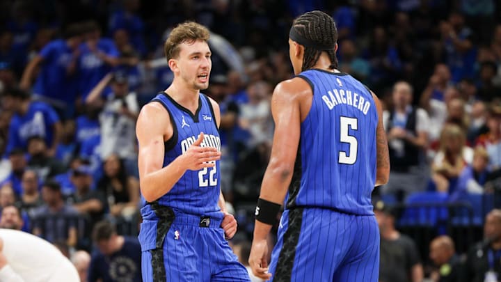 Apr 27, 2024; Orlando, Florida, USA; Orlando Magic forward Franz Wagner (22) and forward Paolo Banchero (5) celebrate after a basket against the Cleveland Cavaliers in the third quarter during game four of the first round for the 2024 NBA playoffs at Kia Center. Mandatory Credit: Nathan Ray Seebeck-Imagn Images