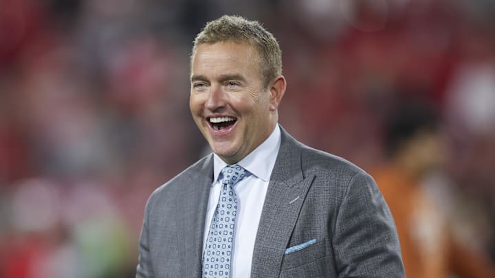 ESPN analyst Kirk Herbstreit smiles prior to a game ESPN analyst Kirk Herbstreit smiles prior to a game