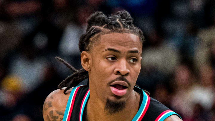 Memphis Grizzlies point guard Ja Morant dribbles the ball around the top of the key in the first half against the Utah Jazz.