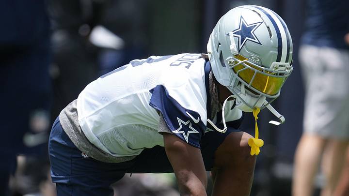Dallas Cowboys wide receiver George Pickens stretches before practice at the Ford Center.