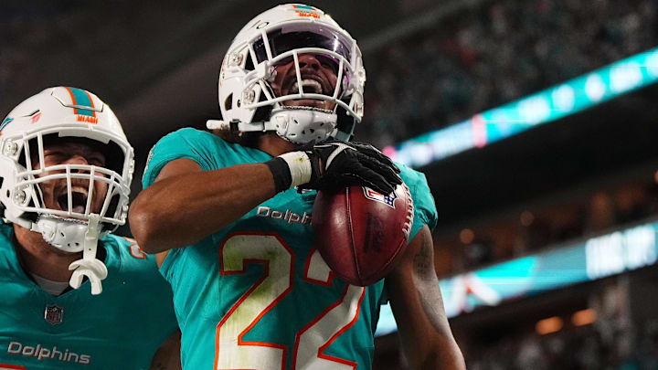 Dec 11, 2023; Miami Gardens, Florida, USA; Miami Dolphins safety Elijah Campbell (22) celebrates with teammates after recovering a muffed punt against the Tennessee Titans during the second half at Hard Rock Stadium. Mandatory Credit: Jasen Vinlove-Imagn Images