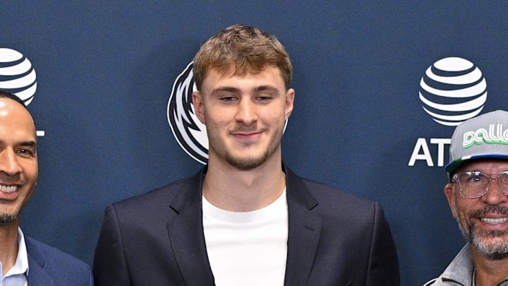 Jun 27, 2025; Dallas, TX, USA; (from left) Dallas Mavericks general manager Nico Harrison and Mavericks first overall pick Cooper Flagg and head coach Jason Kidd pose for a photo at the Dallas Mavericks Practice Facility. Mandatory Credit: Jerome Miron-Imagn Images