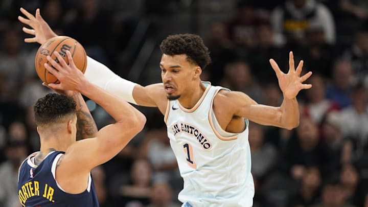 San Antonio Spurs center Victor Wembanyama (1) pressures Denver Nuggets forward Michael Porter Jr. (1) during the first half at Frost Bank Center. San Antonio Spurs center Victor Wembanyama (1) pressures Denver Nuggets forward Michael Porter Jr. (1) during the first half at Frost Bank Center.