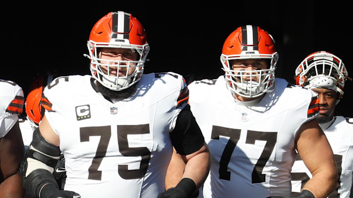 Dec 8, 2024; Pittsburgh, Pennsylvania, USA;  Cleveland Browns guards Germain Ifedi (65) and Joel Bitonio (75) and Wyatt Teller (77) take the field to play the Pittsburgh Steelers at Acrisure Stadium. Mandatory Credit: Charles LeClaire-Imagn Images
