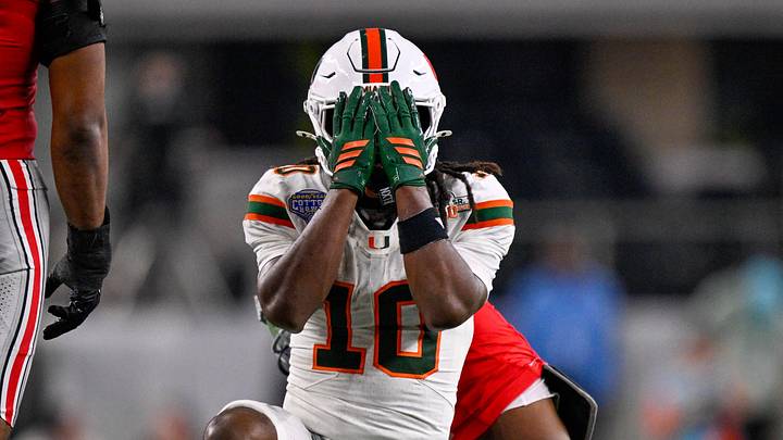 Dec 31, 2025; Arlington, TX, USA; Miami Hurricanes wide receiver Malachi Toney (10) covers his face during the 2025 Cotton Bowl and quarterfinal game of the College Football Playoff at AT&T Stadium. Mandatory Credit: Jerome Miron-Imagn Images
