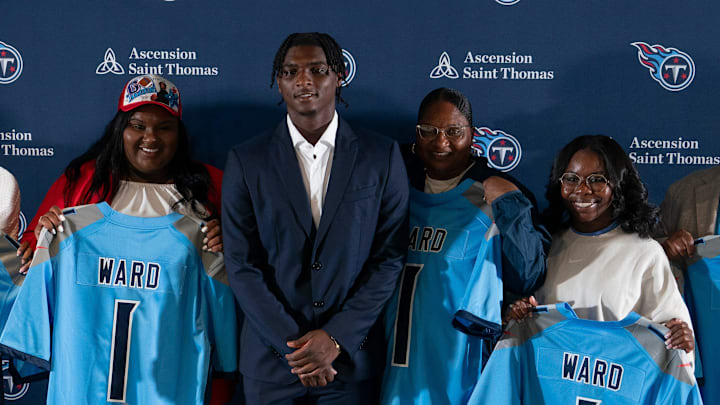Cam Ward, center, poses for pictures with his family and girlfriend after being introduced as the Tennessee Titans first-round pick – and overall number one pick – in the NFL Draft at Ascension Saint Thomas Sports Park in Nashville, Tenn., Friday, April 25, 2025. They are, from left, Nailah Landon, girlfriend, Chantel Ward, sister, Cam Ward, Patrice Ward, mom, Aaliyah Ward, sister, Calvin Ward, dad.