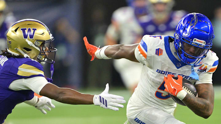 Former Boise State Broncos wide receiver Chris Marshall (5) is stopped by Washington Huskies safety Rahshawn Clark (2) after a complete pass and first down in the second half of the LA Bowl at SoFi Stadium.
