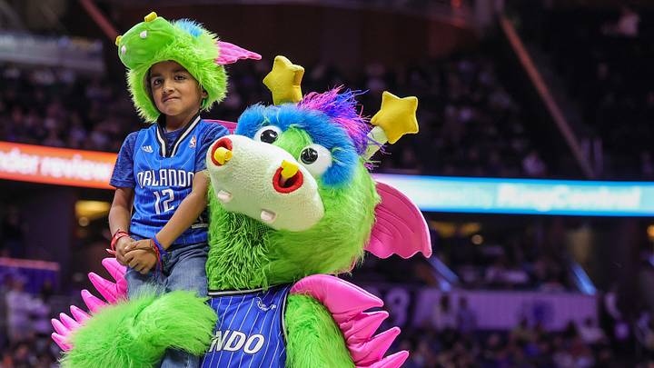 Dec 27, 2025; Orlando, Florida, USA; Orlando Magic mascot Stuff gives a young fan a lift during the second half against the Denver Nuggets at Kia Center. Mandatory Credit: Mike Watters-Imagn Images Dec 27, 2025; Orlando, Florida, USA; Orlando Magic mascot Stuff gives a young fan a lift during the second half against the Denver Nuggets at Kia Center. Mandatory Credit: Mike Watters-Imagn Images