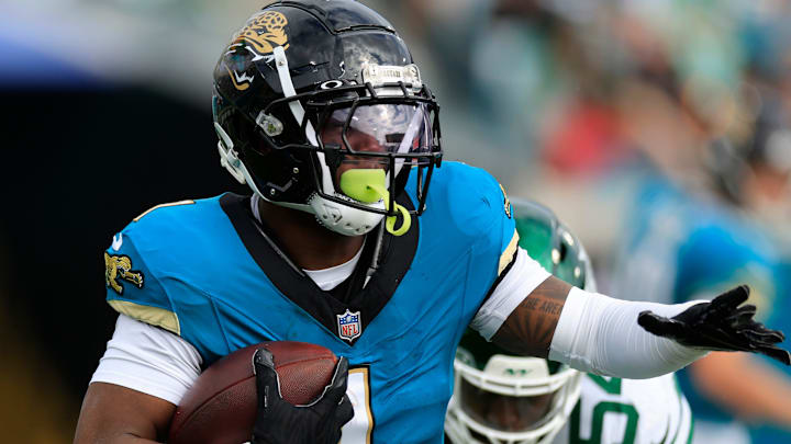 Jacksonville Jaguars running back Travis Etienne Jr. (1) rushes for yards during the second quarter Sunday, Dec. 15, 2024 at EverBank Stadium in Jacksonville, Fla. [Corey Perrine/Florida Times-Union]