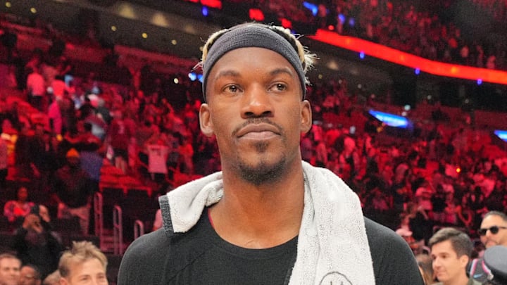 Jan 19, 2025; Miami, Florida, USA;  Miami Heat forward Jimmy Butler (22) walks off the court after greeting court-side friends following the victory over the San Antonio Spurs at Kaseya Center. Mandatory Credit: Jim Rassol-Imagn Images