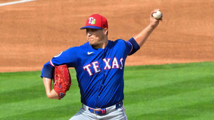 Texas Rangers pitcher Robert Garcia throws a baseball during a game. 