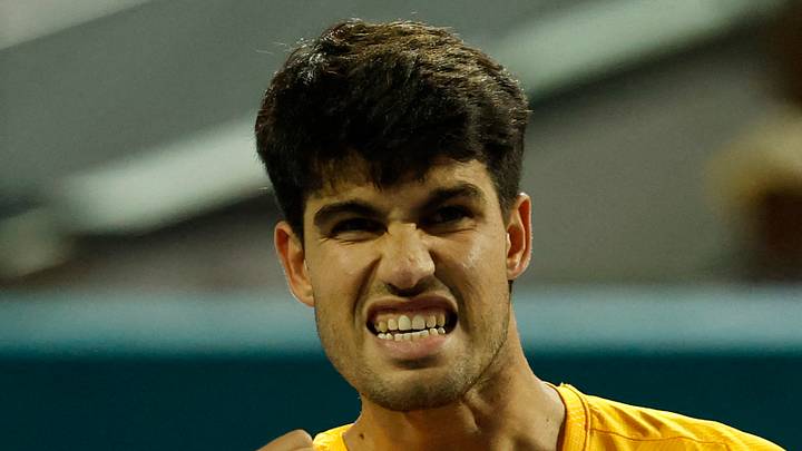 Carlos Alcaraz reacts after winning a point