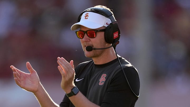 Aug 30, 2025; Los Angeles, California, USA; Southern California Trojans head coach Lincoln Riley watches from the sidelines against the Missouri State Bears in the first half at United Airlines Field at Los Angeles Memorial Coliseum. Mandatory Credit: Kirby Lee-Imagn Images