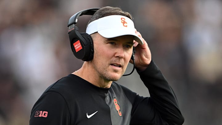 Sep 13, 2025; West Lafayette, Indiana, USA; Southern California Trojans head coach Lincoln Riley stands on the sidelines during the first quarter against the Purdue Boilermakers at Ross-Ade Stadium. Mandatory Credit: Marc Lebryk-Imagn Images Sep 13, 2025; West Lafayette, Indiana, USA; Southern California Trojans head coach Lincoln Riley stands on the sidelines during the first quarter against the Purdue Boilermakers at Ross-Ade Stadium. Mandatory Credit: Marc Lebryk-Imagn Images