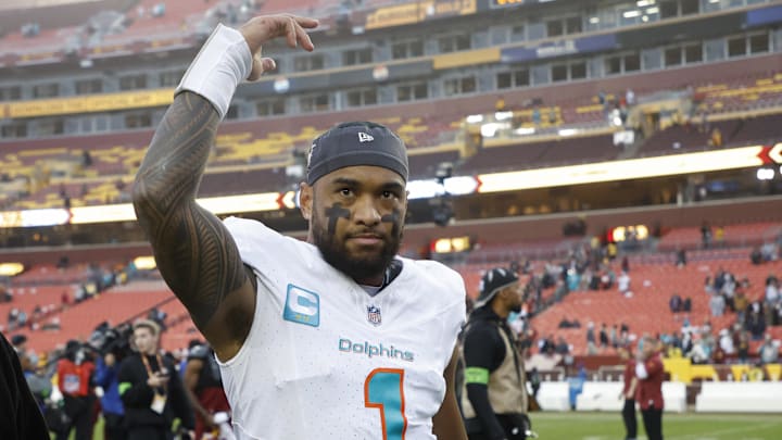 Dec 3, 2023; Landover, Maryland, USA; Miami Dolphins quarterback Tua Tagovailoa (1) waves to fans