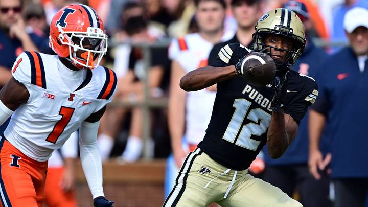 Purdue Boilermakers wide receiver Corey Smith (12) catches a pass against the Illinois Fighting Illini. Purdue Boilermakers wide receiver Corey Smith (12) catches a pass against the Illinois Fighting Illini.