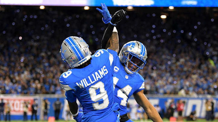 Detroit Lions wide receiver Jameson Williams (9) celebrates with wide receiver Amon-Ra St. Brown (14) Detroit Lions wide receiver Jameson Williams (9) celebrates with wide receiver Amon-Ra St. Brown (14)