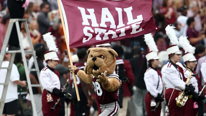 Mississippi State Bulldogs mascot Bully waves a “Hail State” flag prior to the game against the Texas Longhorns at Davis Wade Stadium at Scott Field.