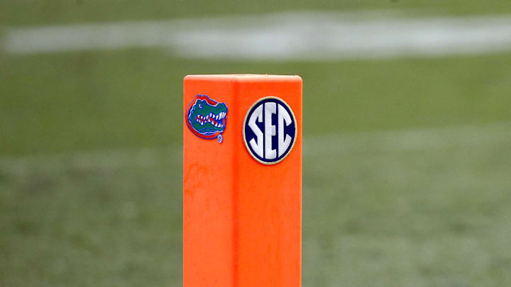 A detailed view of the end zone pylon with a Florida Gators and SEC logo 