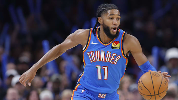 Oct 30, 2025; Oklahoma City, Oklahoma, USA; Oklahoma City Thunder guard Isaiah Joe (11) dribbles down the court against the Washington Wizards during the second half at Paycom Center. Mandatory Credit: Alonzo Adams-Imagn Images