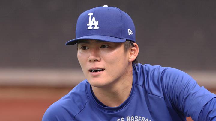 Los Angeles Dodgers pitcher Yoshinobu Yamamoto (18) warms up