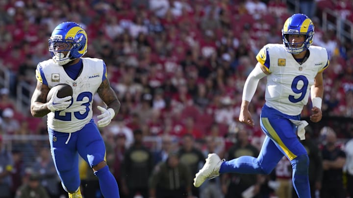 Nov 9, 2025; Santa Clara, California, USA; Los Angeles Rams running back Kyren Williams (23) runs for a touchdown as Los Angeles Rams quarterback Matthew Stafford (9) watches during the first quarter against the San Francisco 49ers at Levi's Stadium. Mandatory Credit: Kyle Terada-Imagn Images