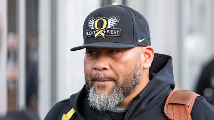 Oregon defensive line coach Tony Tuioti walks into the hotel as the Oregon Ducks arrive in Los Angeles ahead of the Rose Bowl Sunday, Dec. 29, 2024.