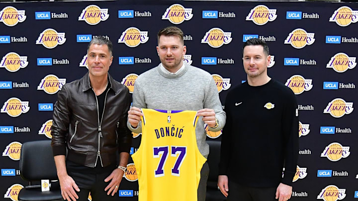 Feb 4, 2025; El Segundo, CA, USA; Los Angeles Lakers guard Luka Doncic, vice president of basketball operations Rob Pelinka and head coach JJ Redick pose for photos at UCLA Health Training Center. Mandatory Credit: Gary A. Vasquez-Imagn Images