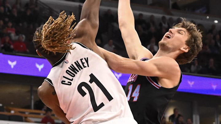Dec 3, 2025; Chicago, Illinois, USA;  Chicago Bulls forward Matas Buzelis (14) shoots against Brooklyn Nets forward Noah Clowney (21) during the first half at the United Center. Mandatory Credit: Matt Marton-Imagn Images