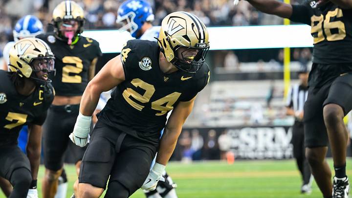Nov 22, 2025; Nashville, Tennessee, USA; Vanderbilt Commodores linebacker Nick Rinaldi (24) celebrates the sack of Kentucky Wildcats quarterback Cutter Boley (8) during the first half at FirstBank Stadium. Mandatory Credit: Steve Roberts-Imagn Images Nov 22, 2025; Nashville, Tennessee, USA; Vanderbilt Commodores linebacker Nick Rinaldi (24) celebrates the sack of Kentucky Wildcats quarterback Cutter Boley (8) during the first half at FirstBank Stadium. Mandatory Credit: Steve Roberts-Imagn Images