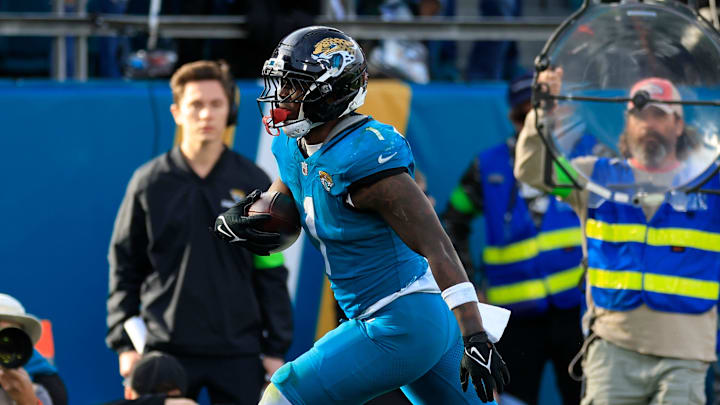 Jacksonville Jaguars running back Travis Etienne Jr. (1) scores a touchdown during the fourth quarter of an NFL football AFC Wild Card playoff matchup, Sunday, Jan. 11, 2026, in Jacksonville, Fla. The Bills defeated the Jaguars 27-24. Jacksonville Jaguars running back Travis Etienne Jr. (1) scores a touchdown during the fourth quarter of an NFL football AFC Wild Card playoff matchup, Sunday, Jan. 11, 2026, in Jacksonville, Fla. The Bills defeated the Jaguars 27-24.
