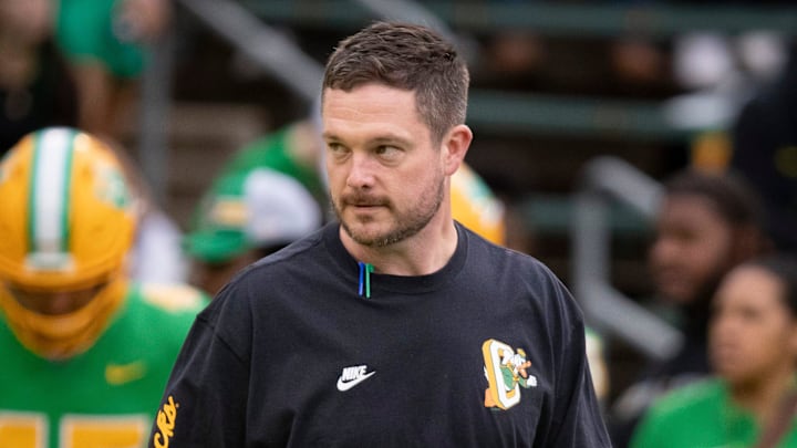 Oregon coach dan lanning ducks dante moore iowa hawkeyes kinnick stadium wave hostile fans playoff upset big ten road game schedule rankings snub