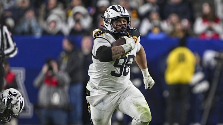 Dec 14, 2024; Landover, Maryland, USA;  Navy Midshipmen defensive tackle Landon Robinson (96) runs on na fake punt during the second half  against the Army Black Knights at Commanders Field. Mandatory Credit: Tommy Gilligan-Imagn Images