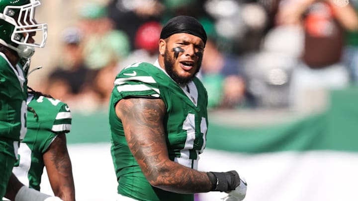 Oct 19, 2025; East Rutherford, New Jersey, USA; New York Jets linebacker Jermaine Johnson (11) celebrates a defensive stop in the first quarter against the Carolina Panthers at MetLife Stadium. Mandatory Credit: Vincent Carchietta-Imagn Images