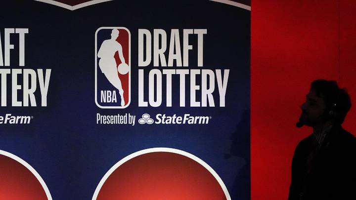 May 12, 2025; Chicago, Illinois, US; A person watches the 2025 NBA Draft Lottery at McCormick Place. Mandatory Credit: David Banks-Imagn Images
