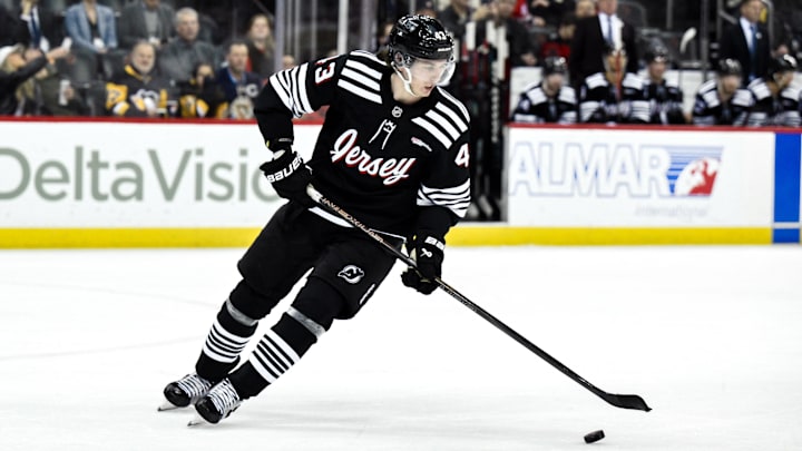 Apr 11, 2025; Newark, New Jersey, USA; New Jersey Devils defenseman Luke Hughes (43) skates with the puck during the third period against the Pittsburgh Penguins at Prudential Center. Mandatory Credit: John Jones-Imagn Images