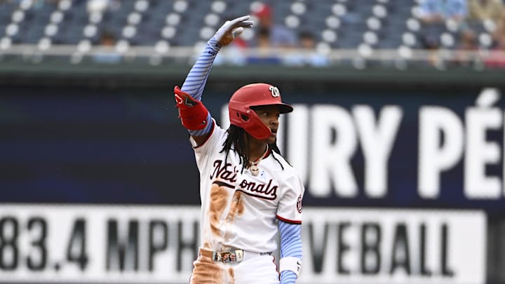 Jun 15, 2025; Washington, District of Columbia, USA; Washington Nationals shortstop CJ Abrams (5) reacts after hitting a double against the Miami Marlins during the first inning at Nationals Park. 
