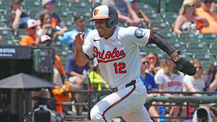 Jul 29, 2025; Baltimore, Maryland, USA; Baltimore Orioles designated hitter Ramon Laureano (12) tags up on a sacrifice fly ball to score during the third inning against the Toronto Blue Jays at Oriole Park at Camden Yards. 