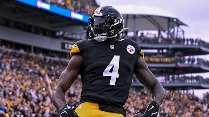 Oct 12, 2025; Pittsburgh, Pennsylvania, USA; Pittsburgh Steelers wide receiver DK Metcalf (4) makes a catch for a touchdown during the fourth quarter at Acrisure Stadium. Mandatory Credit: Barry Reeger-Imagn Images