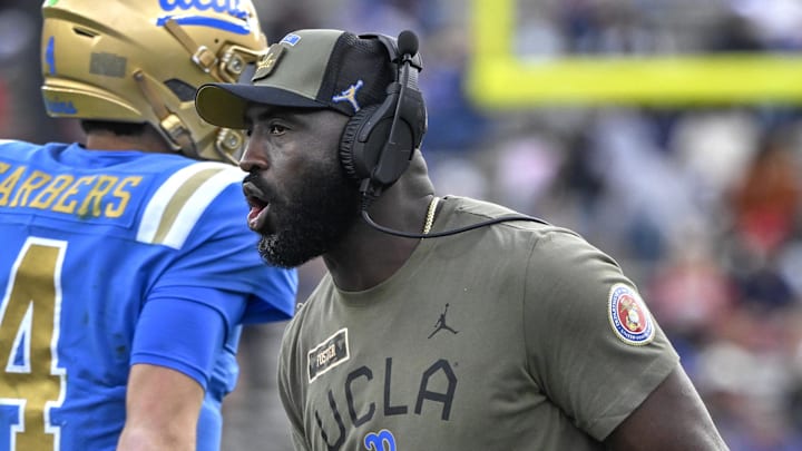 Nov 30, 2024; Pasadena, California, USA; UCLA Bruins head coach DeShaun Foster greets his players after a Bruins touchdown against the Fresno State Bulldogs in the third quarter at Rose Bowl. Mandatory Credit: Robert Hanashiro-Imagn Images