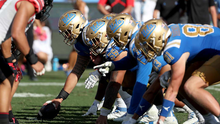Oct 8, 2022; Pasadena, California, USA;  The UCLA Bruins offensive line is seen on a line of the scrimmage against the Utah Utes during the fourth quarter at Rose Bowl. Mandatory Credit: Kiyoshi Mio-Imagn Images