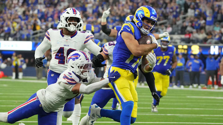Dec 8, 2024; Inglewood, California, USA; Los Angeles Rams wide receiver Puka Nacua (17) scores on a 19-yard touchdown reception against Buffalo Bills cornerback Taron Johnson (7), linebacker Von Miller (40) and linebacker Terrel Bernard (43) in the fourth quarter at SoFi Stadium. Mandatory Credit: Kirby Lee-Imagn Images Dec 8, 2024; Inglewood, California, USA; Los Angeles Rams wide receiver Puka Nacua (17) scores on a 19-yard touchdown reception against Buffalo Bills cornerback Taron Johnson (7), linebacker Von Miller (40) and linebacker Terrel Bernard (43) in the fourth quarter at SoFi Stadium. Mandatory Credit: Kirby Lee-Imagn Images