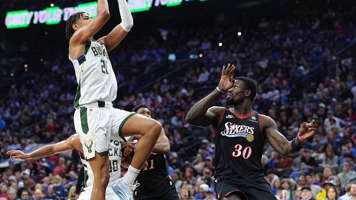 Apr 12, 2026; Philadelphia, Pennsylvania, USA; Milwaukee Bucks forward Ousmane Dieng (21) shoots the ball against Philadelphia 76ers center Adem Bona (30) in the second quarter at Xfinity Mobile Arena. Mandatory Credit: Kyle Ross-Imagn Images Apr 12, 2026; Philadelphia, Pennsylvania, USA; Milwaukee Bucks forward Ousmane Dieng (21) shoots the ball against Philadelphia 76ers center Adem Bona (30) in the second quarter at Xfinity Mobile Arena. Mandatory Credit: Kyle Ross-Imagn Images