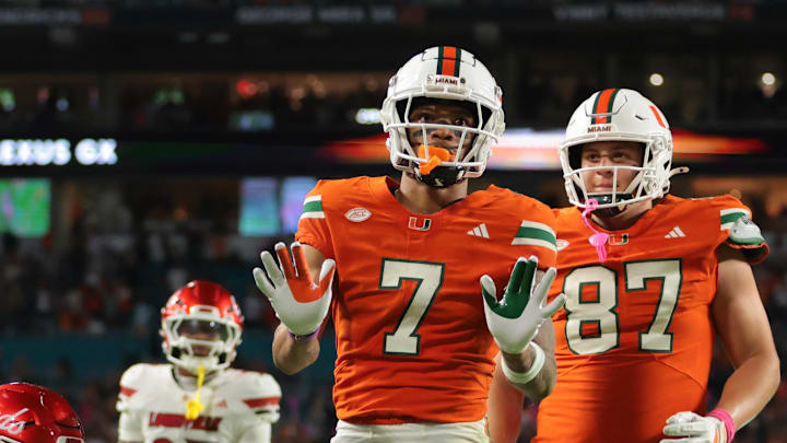 Oct 17, 2025; Miami Gardens, Florida, USA; Miami Hurricanes wide receiver CJ Daniels (7) celebrates after scoring on a two-point conversion against the Louisville Cardinals during the fourth quarter at Hard Rock Stadium. Mandatory Credit: Sam Navarro-Imagn Images Oct 17, 2025; Miami Gardens, Florida, USA; Miami Hurricanes wide receiver CJ Daniels (7) celebrates after scoring on a two-point conversion against the Louisville Cardinals during the fourth quarter at Hard Rock Stadium. Mandatory Credit: Sam Navarro-Imagn Images