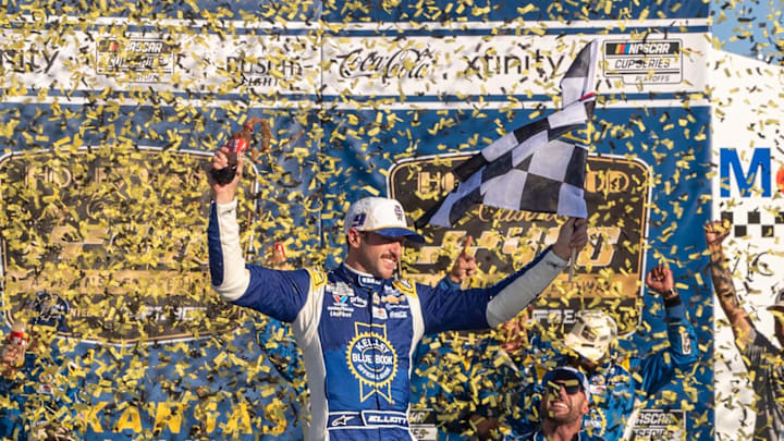 Sep 28, 2025; Kansas City, Kansas, USA; Chase Elliott celebrates with his pit crew at the NASCAR Cup Series Playoff Race at Kansas Speedway.