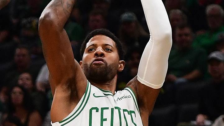 Oct 14, 2026; Boston, Massachusetts, USA;  Boston Celtics forward Paul George (13) shoots the ball over Charlotte Hornets center Naz Reid (0) during the first half at TD Garden. Mandatory Credit: Bob DeChiara-Imagn Images